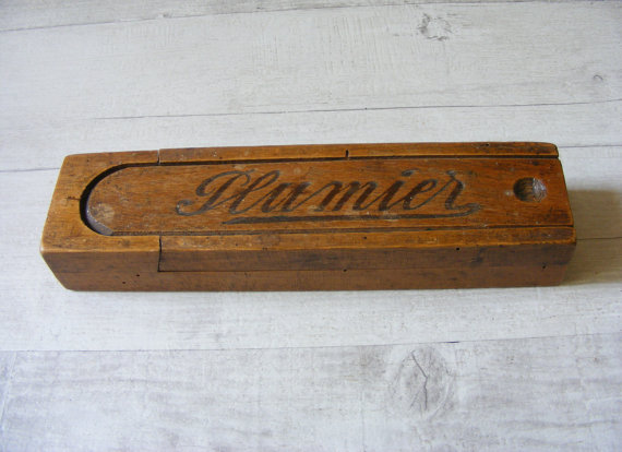 French Vintage wooden pencil box,where is inscribed 'Plumier',with a sliding lid,from the 1940s. 